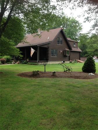 4 Woodlawn Road Freetown, MA 02702 - Photo 30 of 30 a front view of a house with a yard and porch