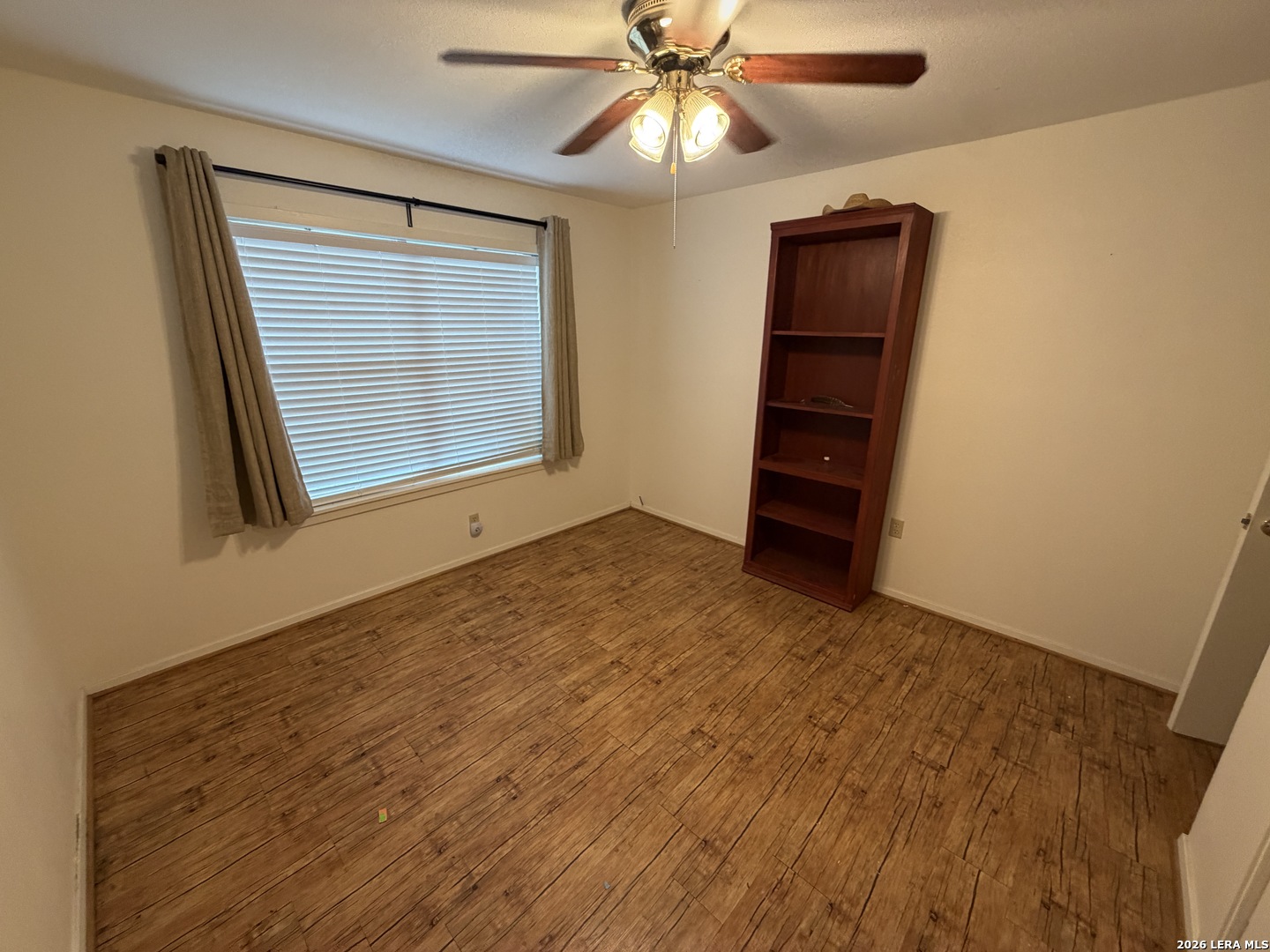 208 South Caves Avenue Three Rivers, TX 78060 - Photo 11 of 13 a view of an empty room with a window and closet