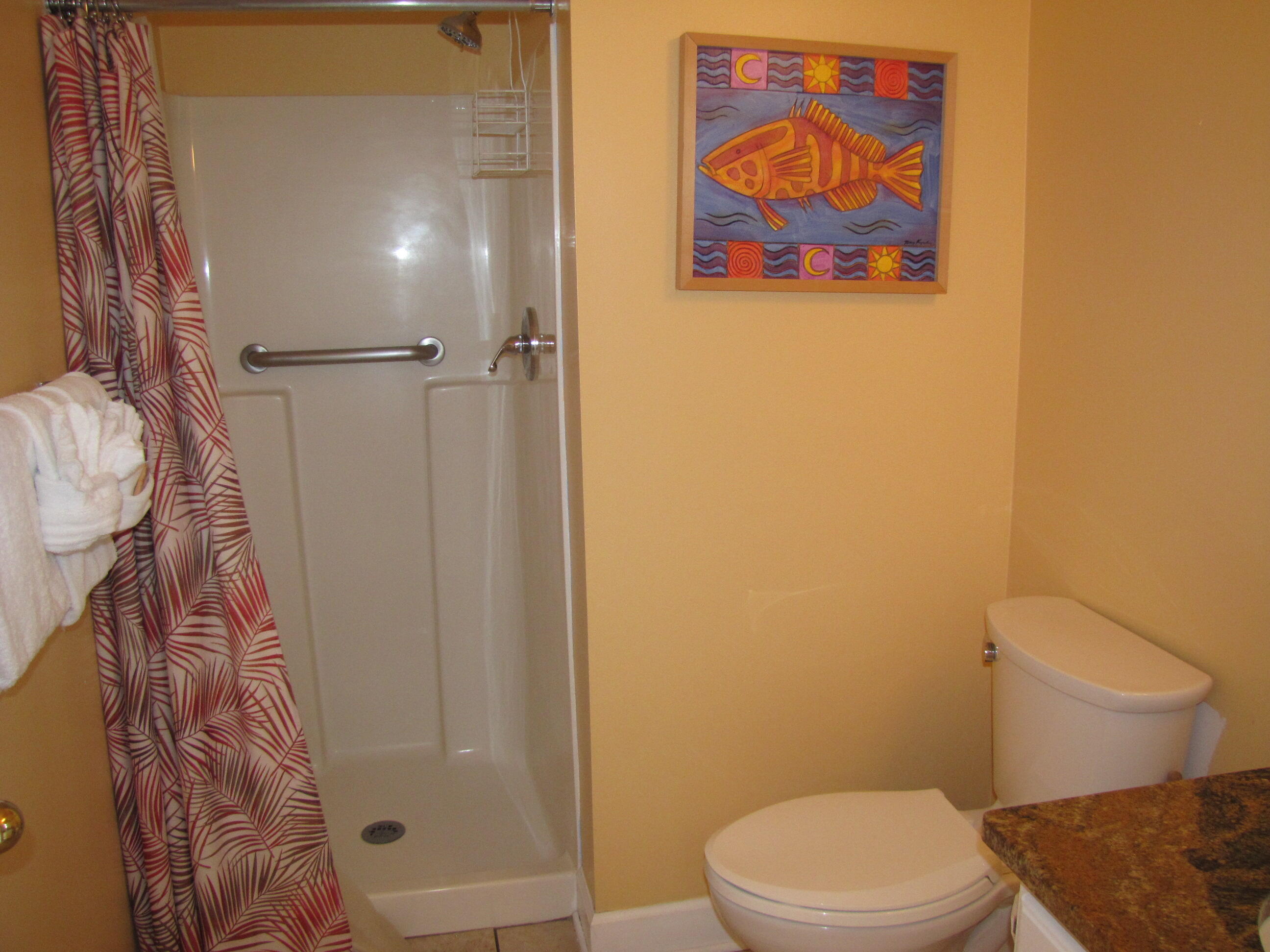 22 Amber Cove Miramar Beach, FL 32550 - Photo 12 of 60 a white toilet sitting next to a shower curtain
