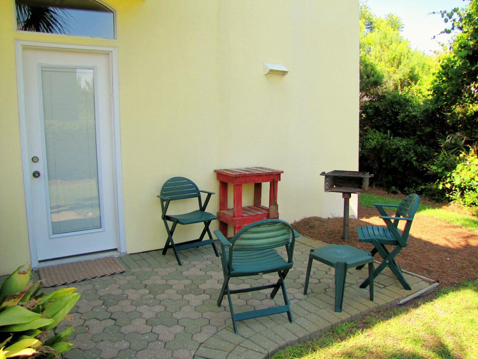22 Amber Cove Miramar Beach, FL 32550 - Photo 14 of 60 a backyard of a house with table and chairs
