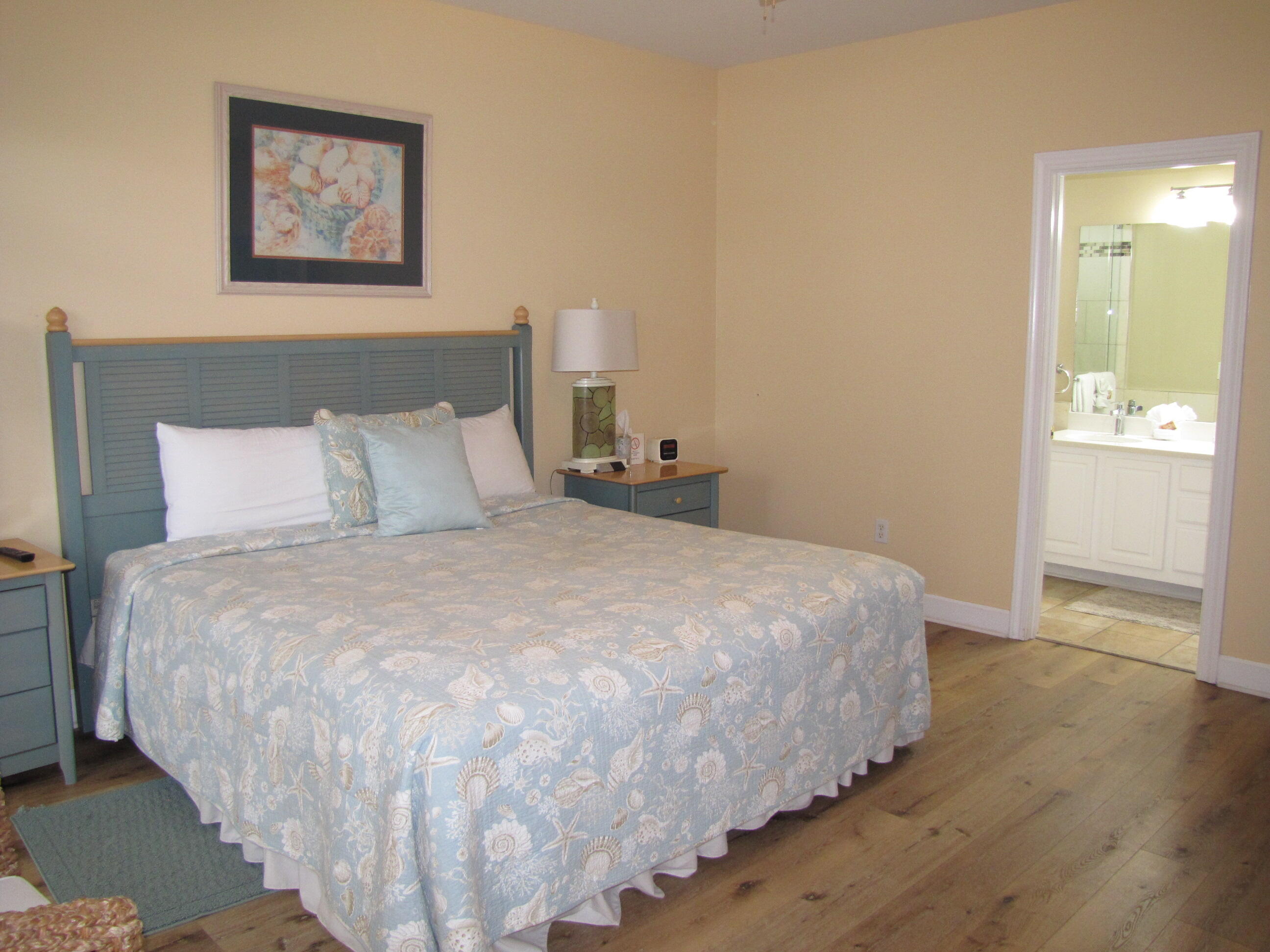 22 Amber Cove Miramar Beach, FL 32550 - Photo 29 of 60 a bedroom with a bed and painting on the wall