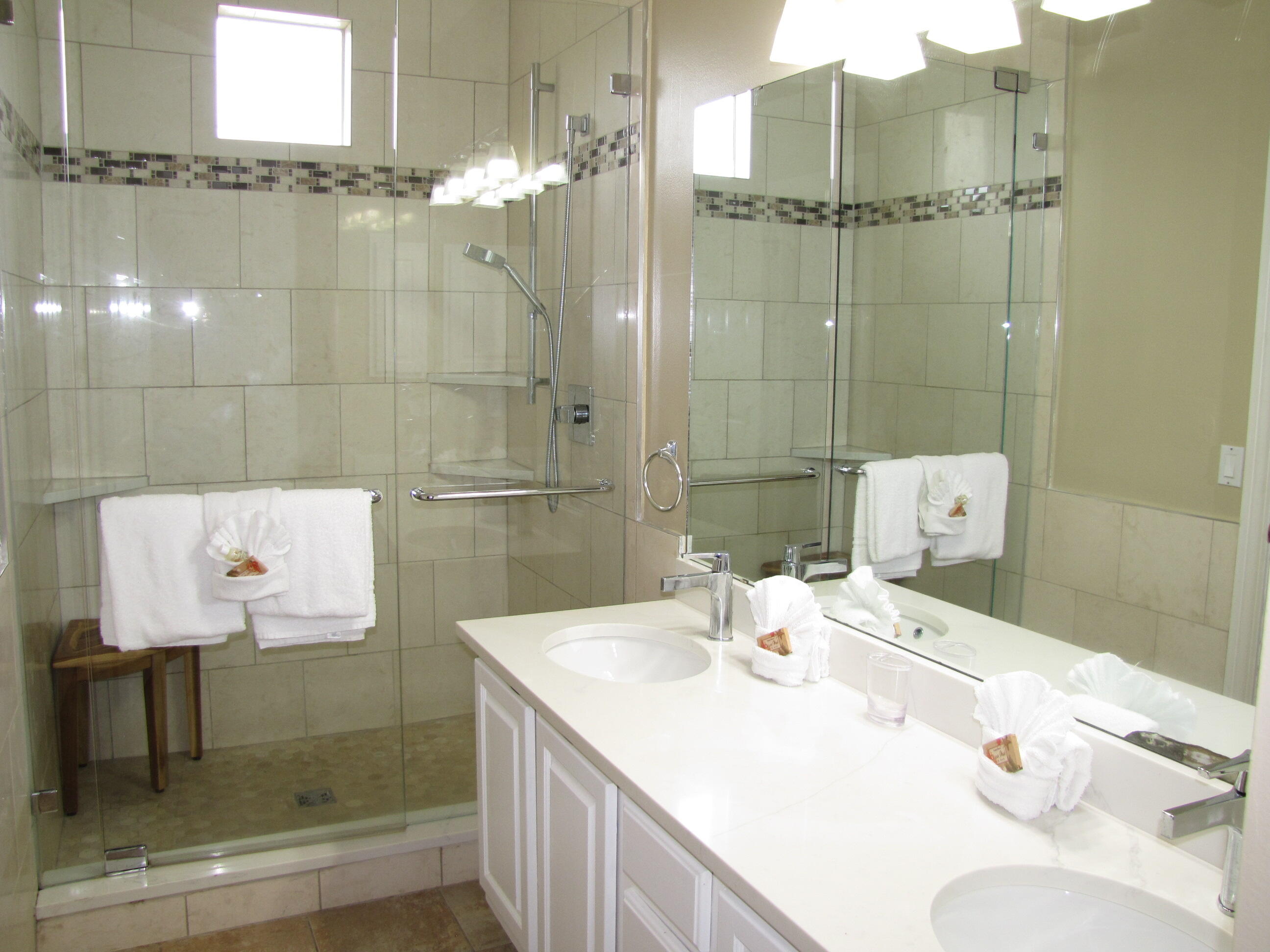 22 Amber Cove Miramar Beach, FL 32550 - Photo 30 of 60 a bathroom with a sink shower and a mirror