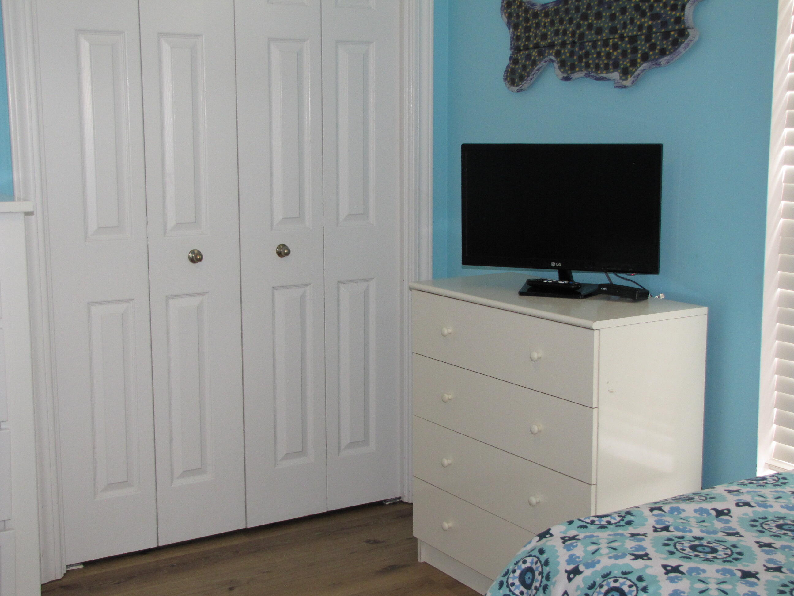 22 Amber Cove Miramar Beach, FL 32550 - Photo 38 of 60 a bedroom with a bed and a flat screen tv