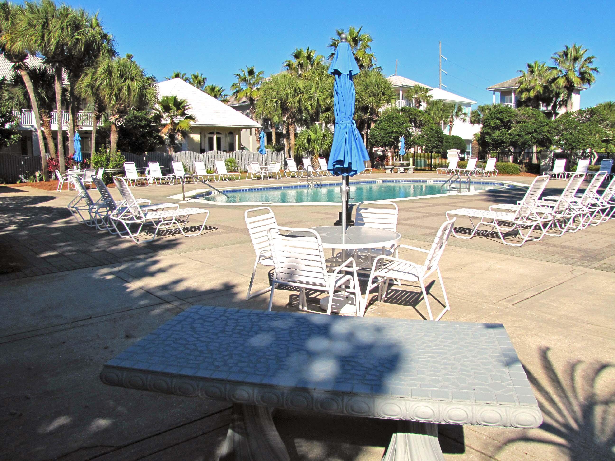 22 Amber Cove Miramar Beach, FL 32550 - Photo 45 of 60 a view of a patio with a table and chairs