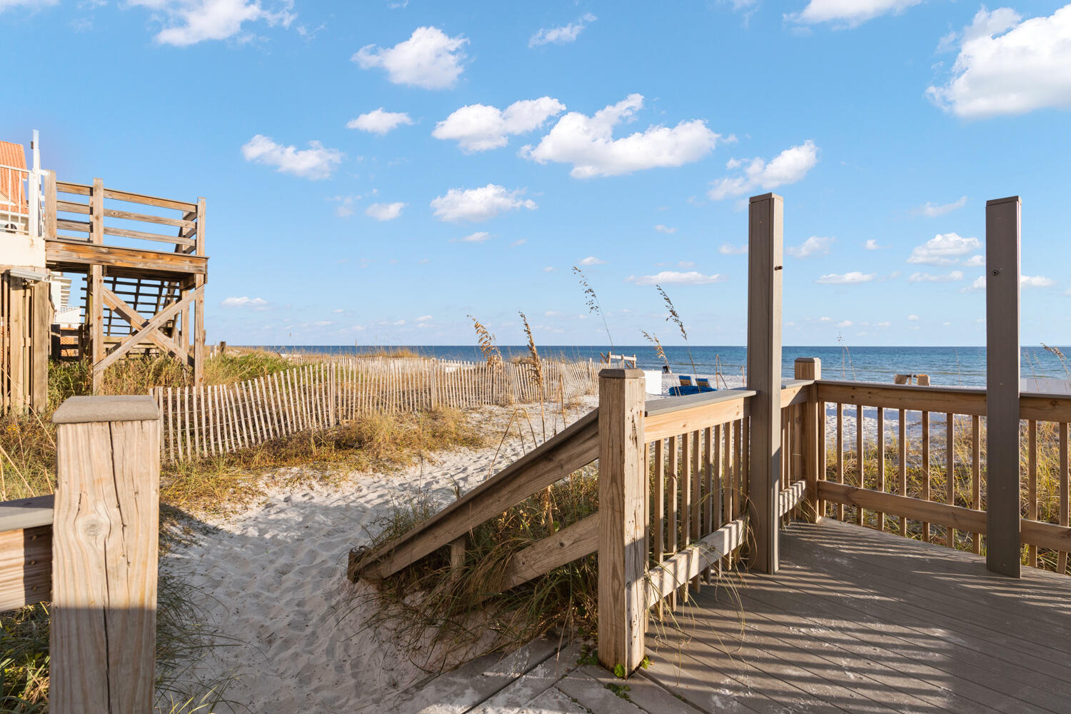 22 Amber Cove Miramar Beach, FL 32550 - Photo 56 of 60 a view of a balcony with floor to ceiling windows and wooden floor