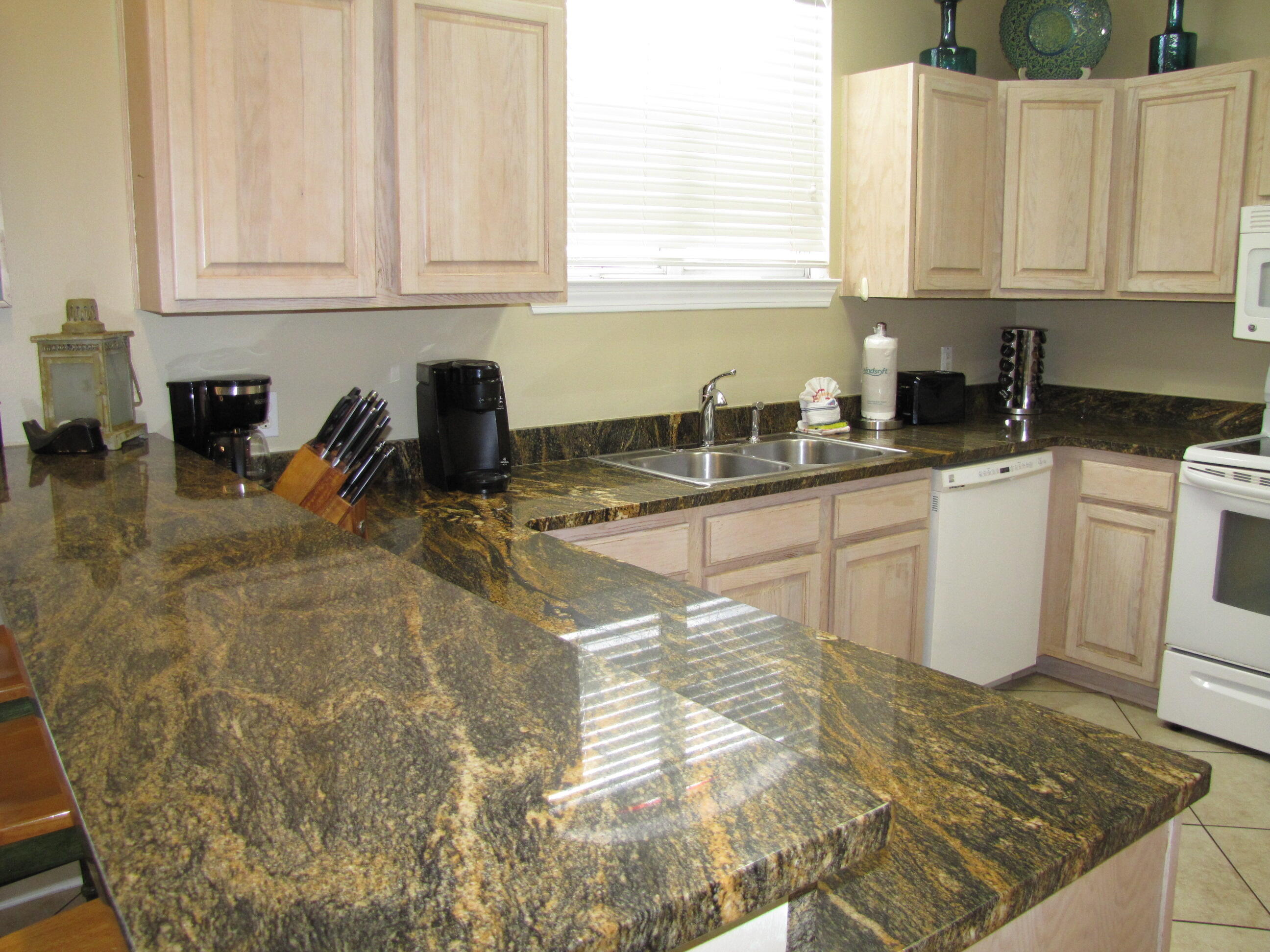 22 Amber Cove Miramar Beach, FL 32550 - Photo 8 of 60 a kitchen with a sink a stove and white cabinets