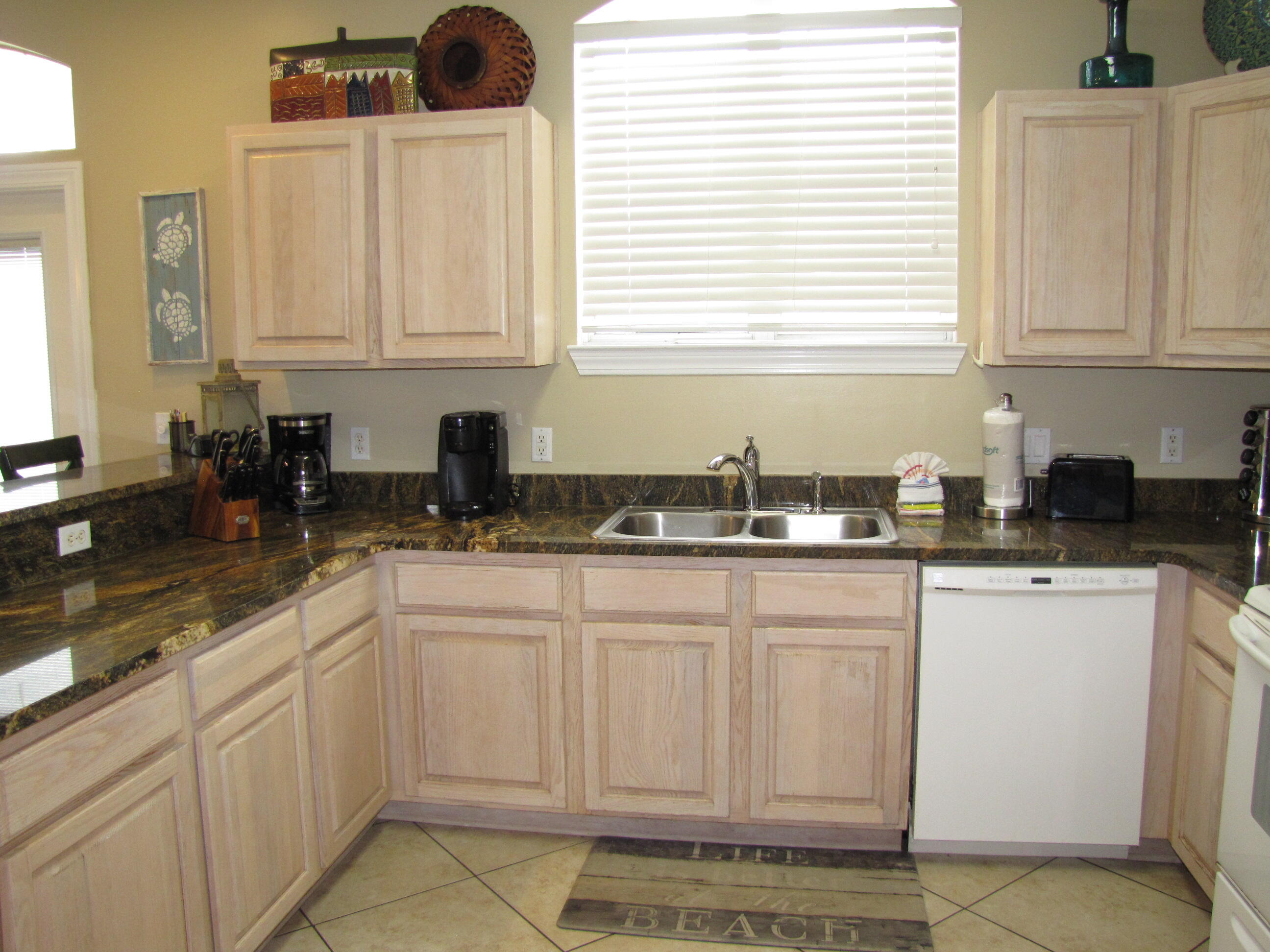 22 Amber Cove Miramar Beach, FL 32550 - Photo 9 of 60 a kitchen with white cabinets and sink