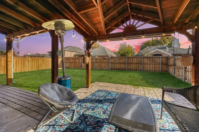 a view of yard with patio