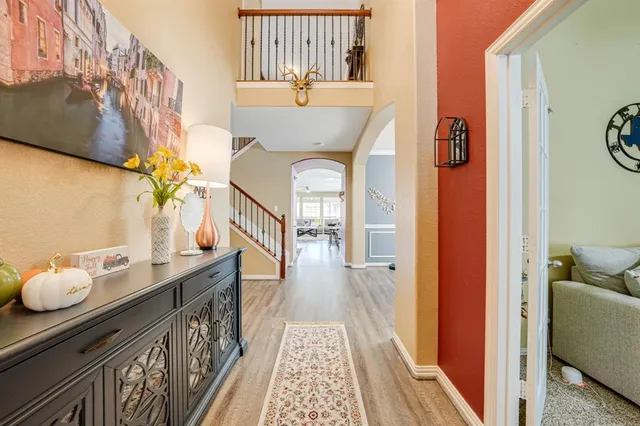 a view of living room with furniture and wooden floor