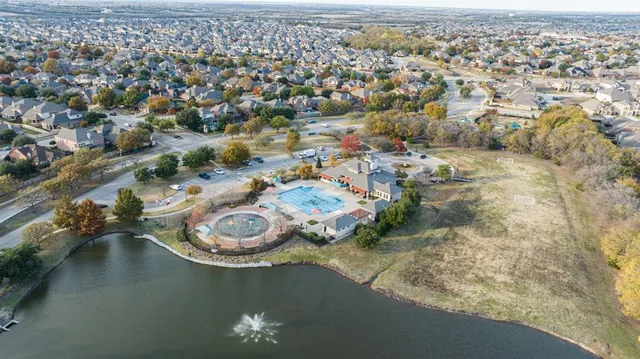 an aerial view of a house with a mountain view