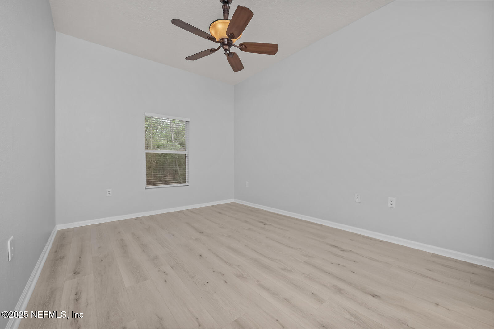 7920 Merrill Road West, Unit 1604 Jacksonville, FL 32277 - Photo 13 of 30 an empty room with a window and a fan
