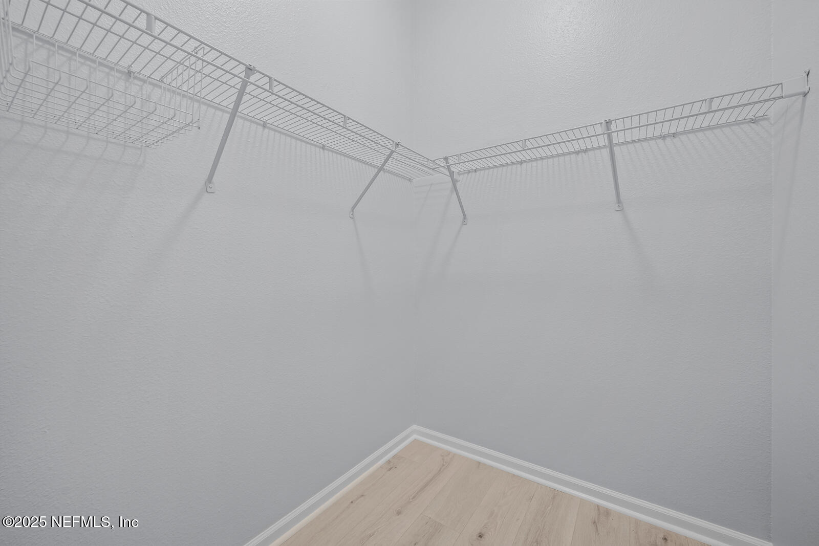 7920 Merrill Road West, Unit 1604 Jacksonville, FL 32277 - Photo 16 of 30 a view of a room with racks on the wall