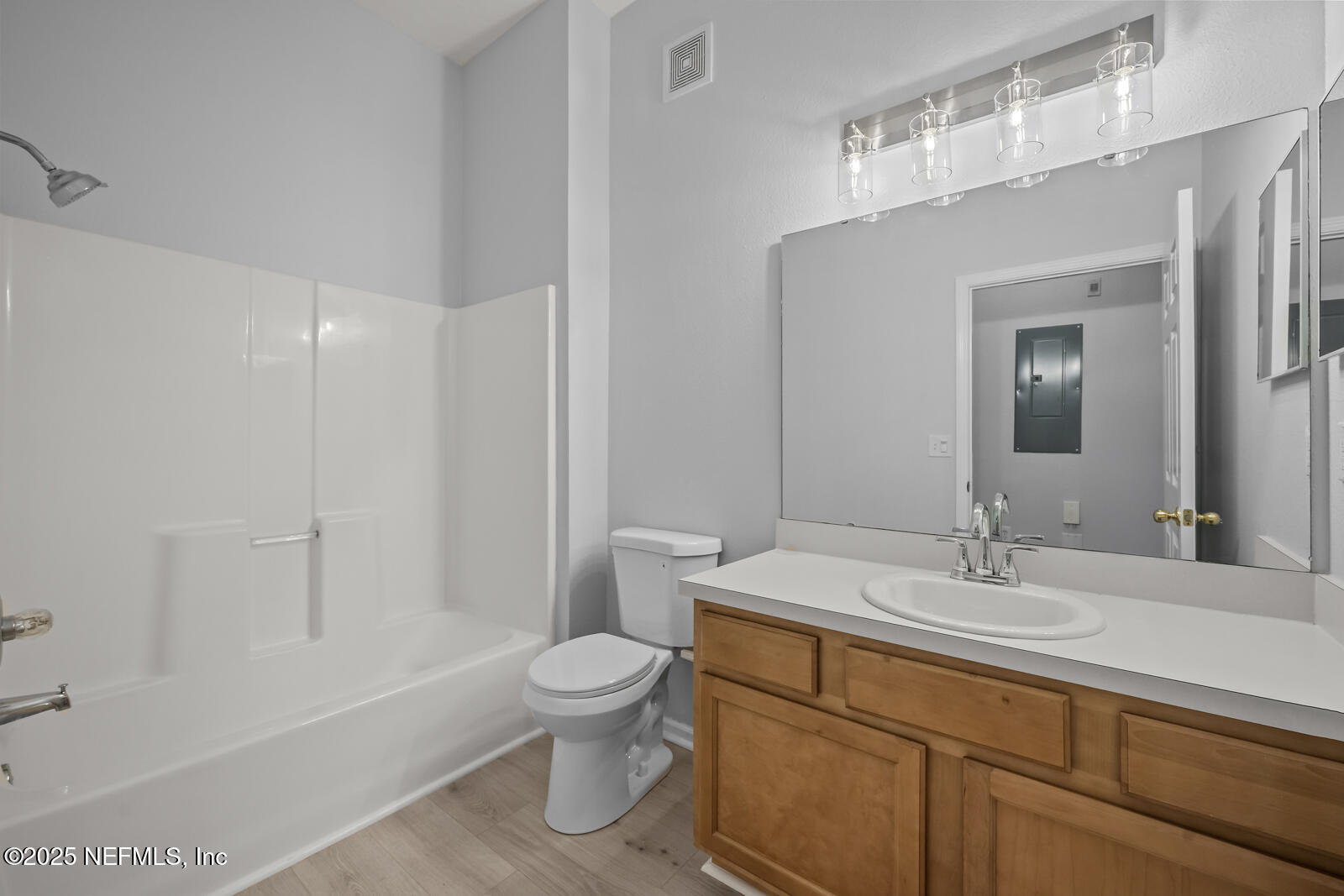 7920 Merrill Road West, Unit 1604 Jacksonville, FL 32277 - Photo 19 of 30 a bathroom with a sink a toilet and shower