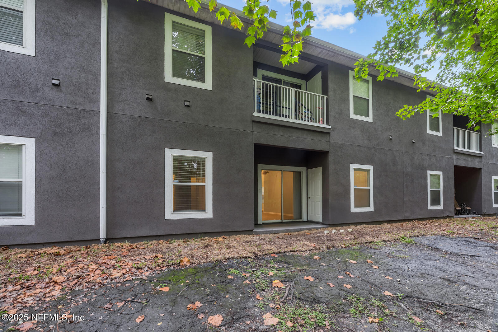 7920 Merrill Road West, Unit 1604 Jacksonville, FL 32277 - Photo 26 of 30 a front view of a house with a yard