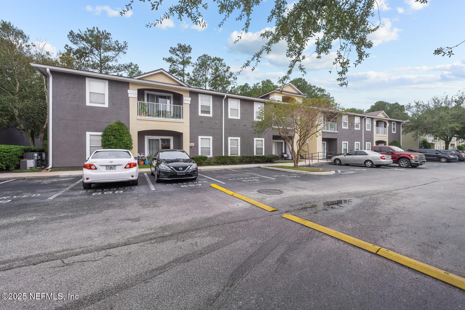 7920 Merrill Road West, Unit 1604 Jacksonville, FL 32277 - Photo 30 of 30 a cars parked in front of a house