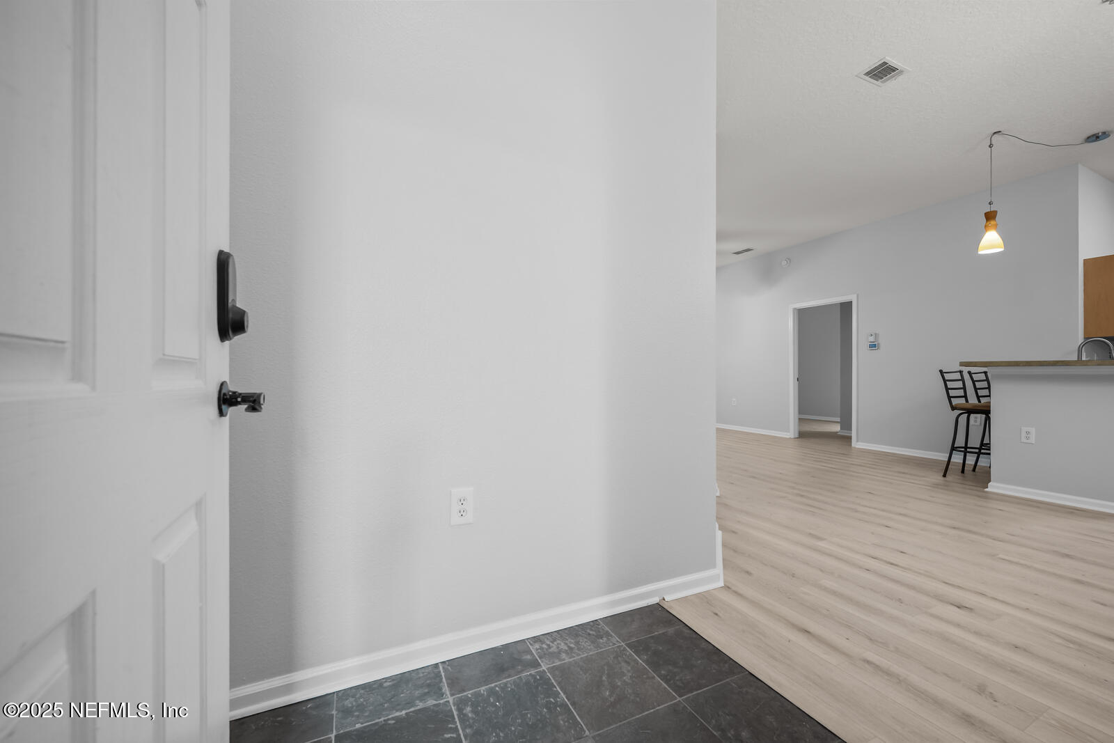 7920 Merrill Road West, Unit 1604 Jacksonville, FL 32277 - Photo 5 of 30 a view of an empty room with wooden floor