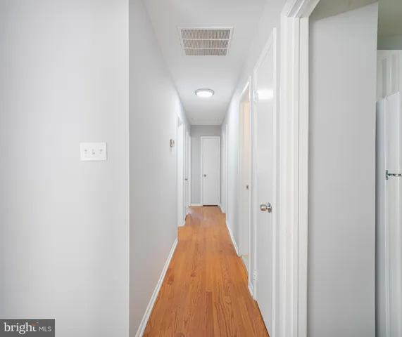 a view of a hallway with windows