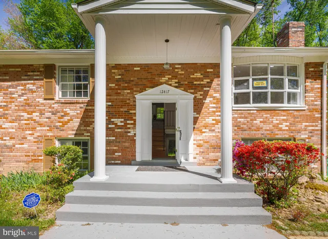 a front view of a house with a porch