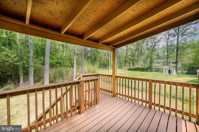 a view of a balcony with wooden floor