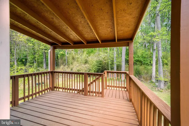 a view of balcony with wooden floor