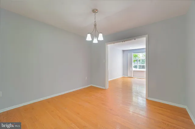 a view of a windows and chandelier in big room