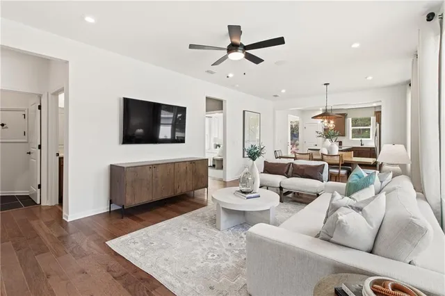 a kitchen with stainless steel appliances a stove a sink island and a refrigerator