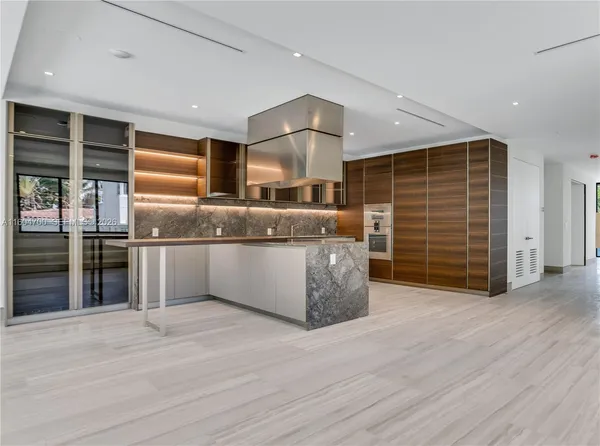 a kitchen with stainless steel appliances granite countertop a stove and a sink