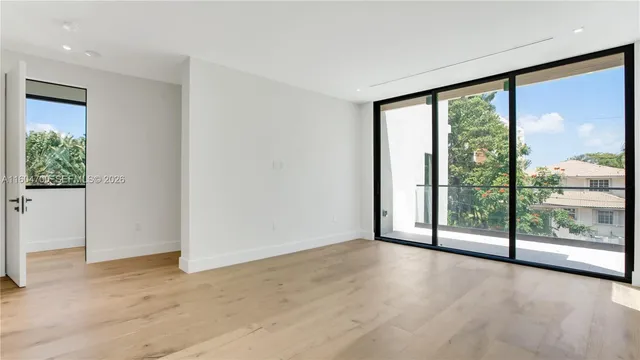 a view of a room with sliding glass door and mountain view