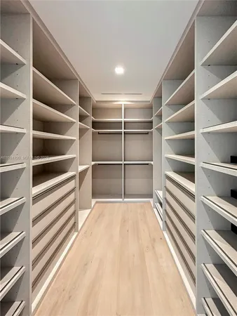 a view of a room with storage and racks on wall