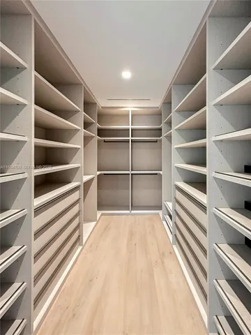 a view of a room with storage and racks on wall