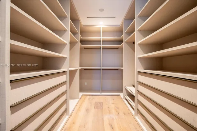 a view of an empty walk in closet