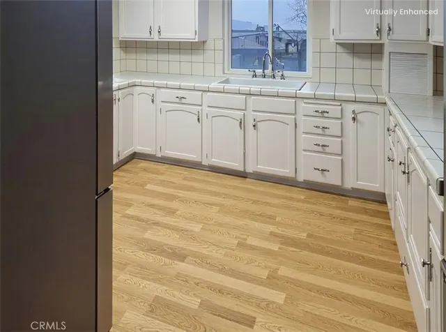 a view of a kitchen with cabinets