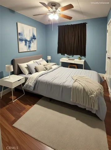 a bedroom with bed and a chandelier