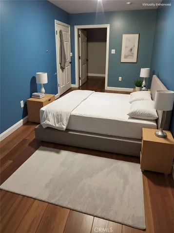 a bedroom with a bed and dresser