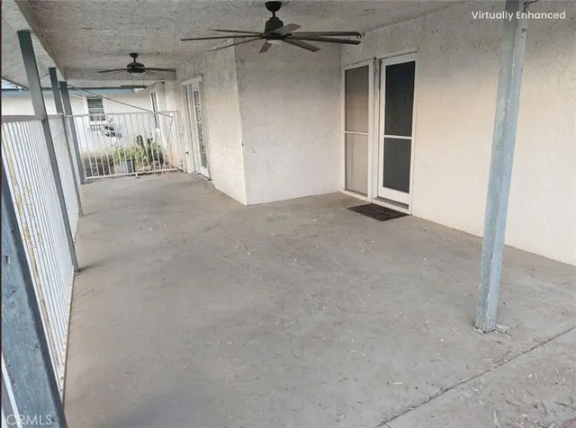 a view of a room with wooden floor and windows