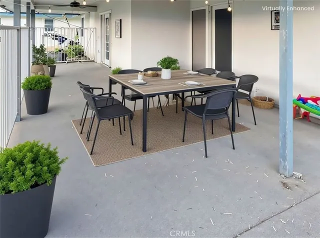 a view of a dining table and chairs in the patio