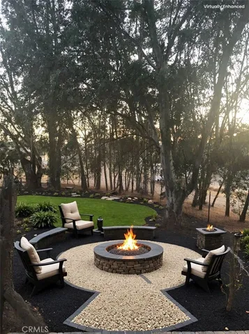 a view of a backyard with sitting area