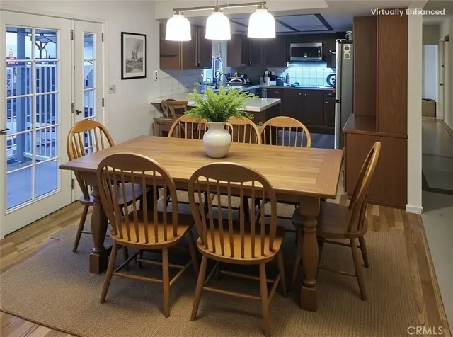 a view of a dining room with furniture and chandelier