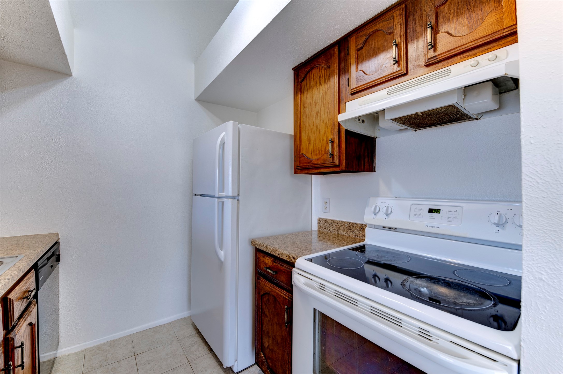 14323 Edenglen Drive Houston, TX 77049 - Photo 11 of 27 a kitchen with stainless steel appliances a stove and a refrigerator