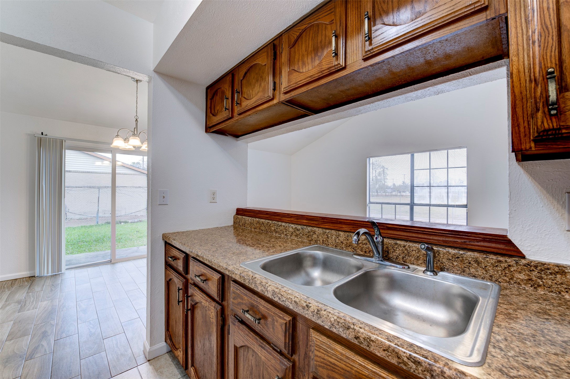 14323 Edenglen Drive Houston, TX 77049 - Photo 12 of 27 a kitchen that has a sink and a stove