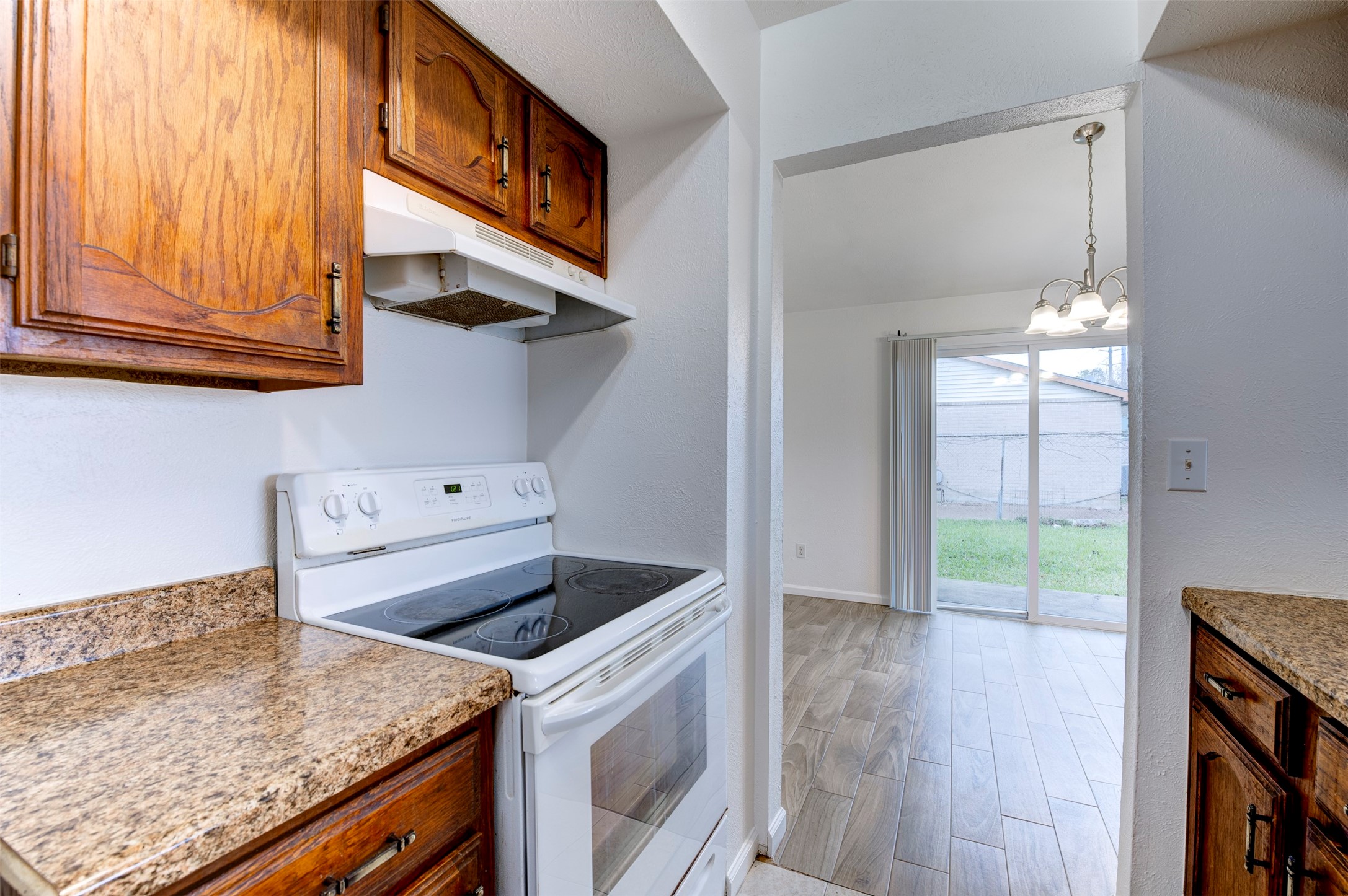 14323 Edenglen Drive Houston, TX 77049 - Photo 13 of 27 a kitchen that has a cabinets and a stove