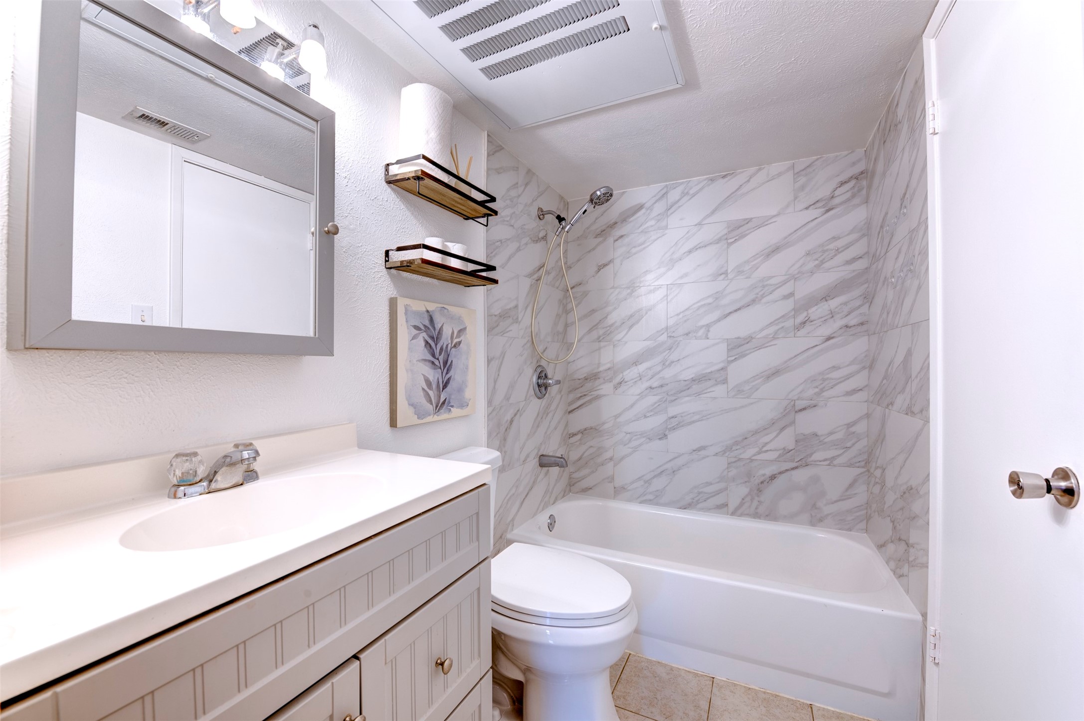 14323 Edenglen Drive Houston, TX 77049 - Photo 19 of 27 a bathroom with a sink a toilet and a bathtub