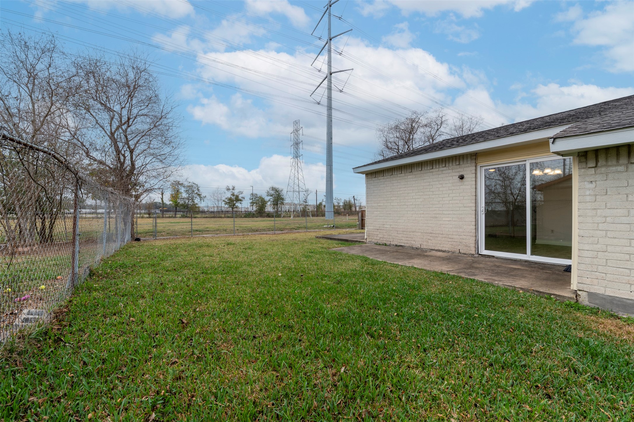 14323 Edenglen Drive Houston, TX 77049 - Photo 25 of 27 a view of a backyard with plants and large trees