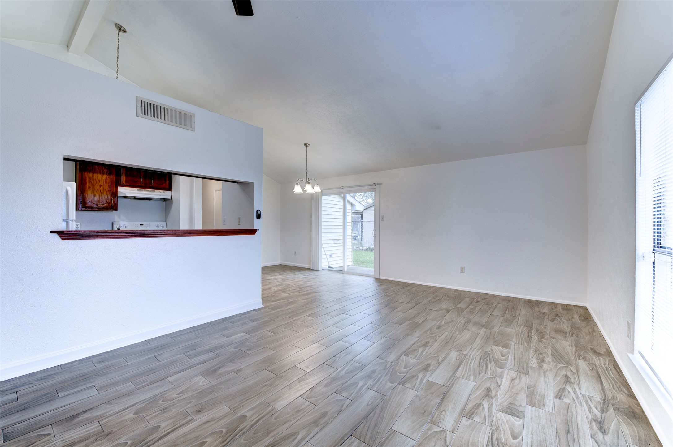 14323 Edenglen Drive Houston, TX 77049 - Photo 5 of 27 a view of empty room with wooden floor and fan