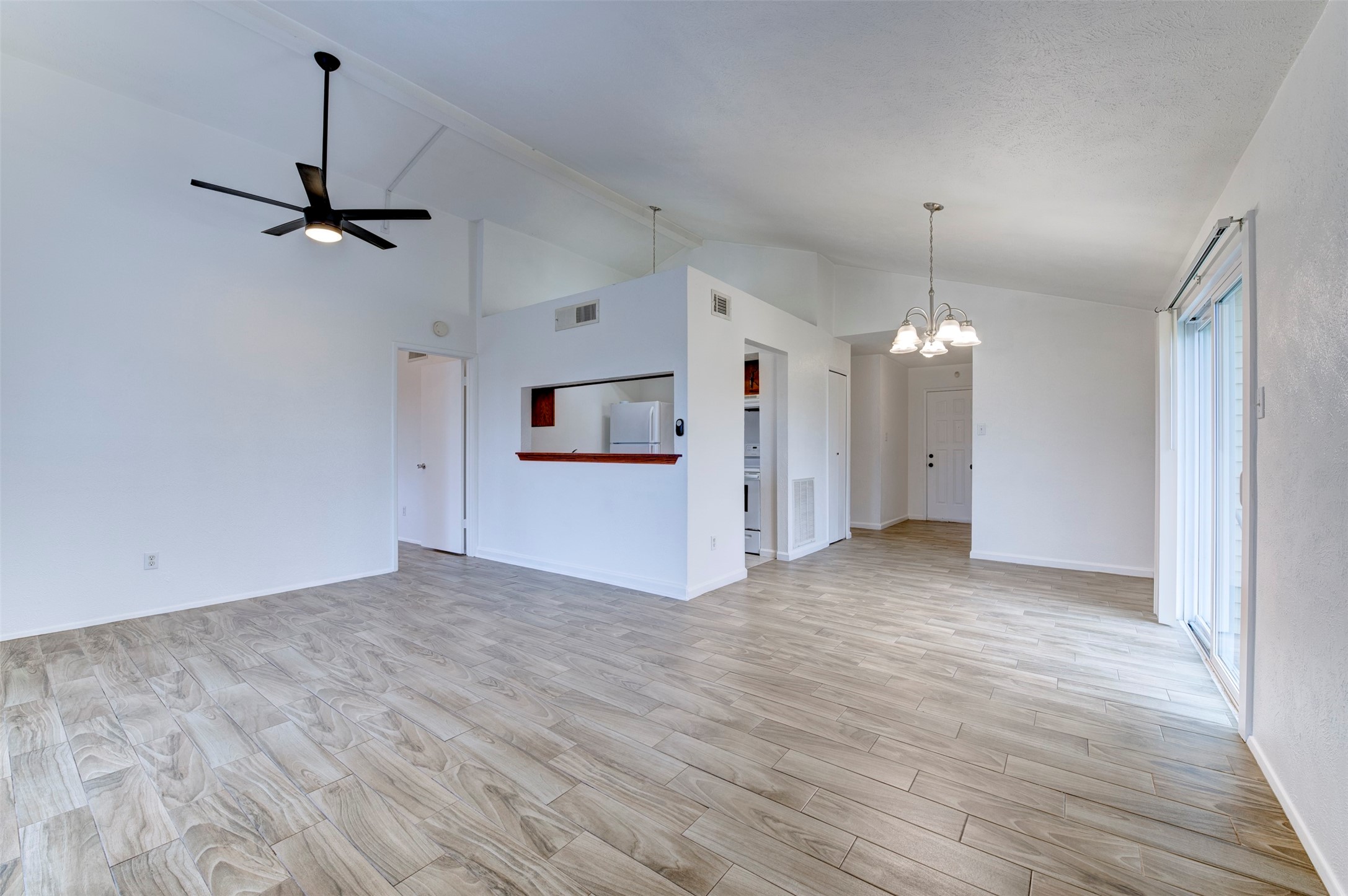 14323 Edenglen Drive Houston, TX 77049 - Photo 8 of 27 a view of empty room with wooden floor