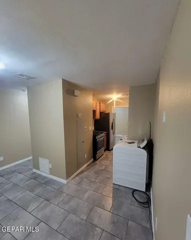 a room with a bed and a mirror