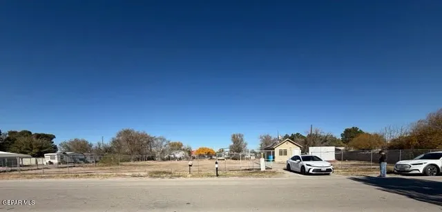 a view of car parked on the side of the road