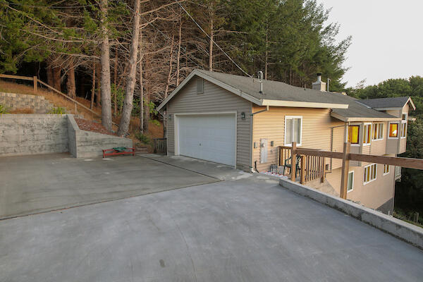 1050 Spring Road Shelter Cove, CA 95589 - Photo 8 of 42 front view of house with large windows