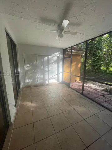 a room with sliding door and mountain view