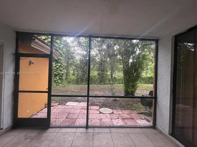 a view of a room with a large window